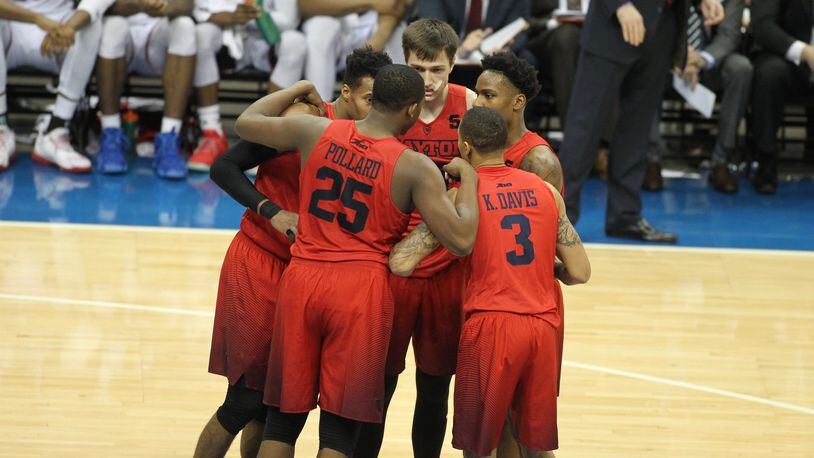 Dayton players huddle during a game against Duquesne on Saturday, Jan. 14, 2017, at PPG Paints Arena in Pittsburgh. David Jablonski/Staff