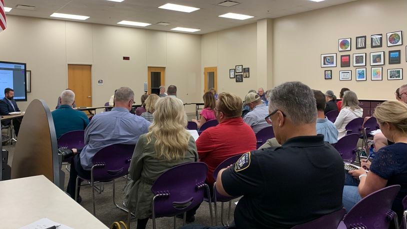 Crowds gathered at the Bellbrook-Sugarcreek school board meeting Thursday as the board voted to create a volunteer Active Shooter Response Team. LONDON BISHOP/STAFF
