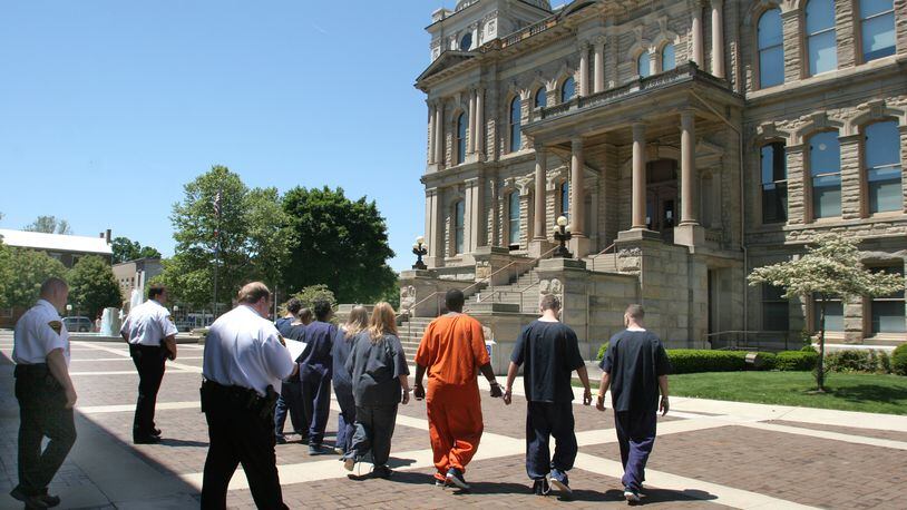 Miami County Sheriff Dave Duchak wants to place security checkpoints at the Miami County Courthouse and Safety Building. In this file photo, bailiffs’ move prisoners from the Sheriffs jail to the old Miami County Courthouse on their way to Municipal Court in Troy.