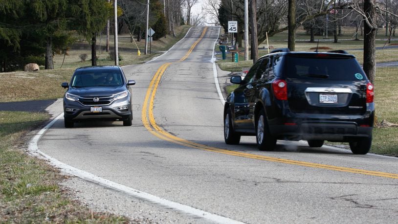 This section of Belvo Road in Miami Twp. is among about 18.3 miles of roadway Montgomery County will begin resurfacing in May. CHRIS STEWART / STAFF