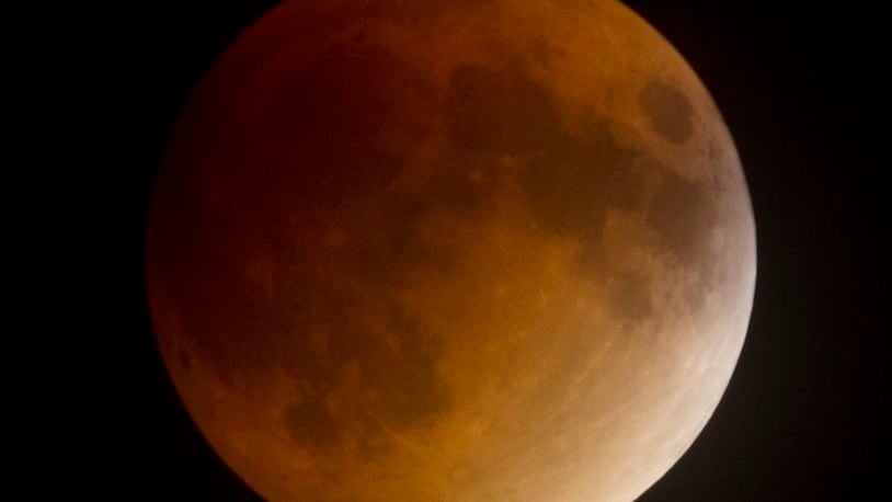 A rare Super Moon coincided with a full lunar eclipse on Sept. 27, 2015, resulting a Blood Moon between 10 p.m. and midnight. The clouds left the the sky just in time for the celestial show. This photo was made shortly after 10. TY GREENLEES / STAFF