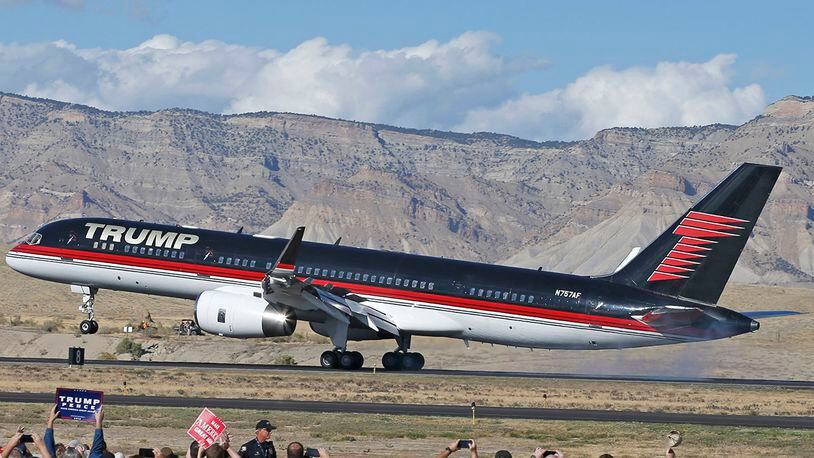 GRAND JUNCTION, CO - OCTOBER 18: Supporters cheer as the plane of Republican presidential candidate Donald Trump lands on October 18, 2016 in Grand Junction Colorado. Trump, who spoke at a rally after landing, is on his way to Las Vegas for the third and final presidential debate against Democratic rival Hillary Clinton. (Photo by George Frey/Getty Images)