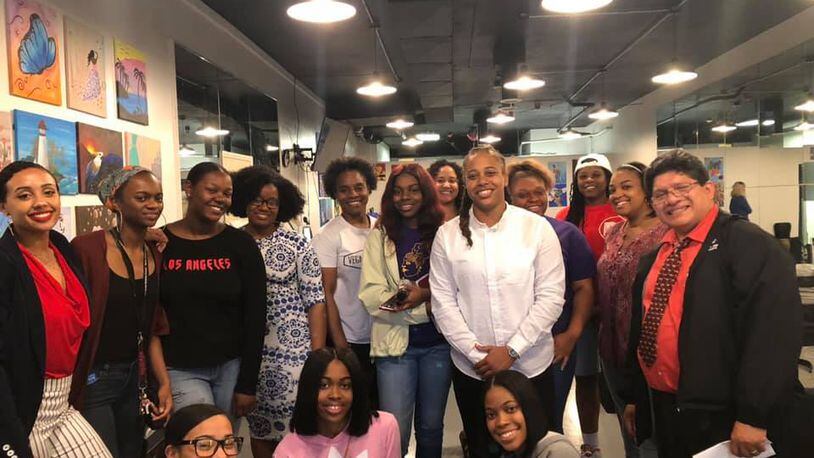 Daj’za Demmings (white shirt) is the president of Dayton Young Black Professionals, one of the organizations hosting a charity event in honor of the late former Dayton City Commissioner Idotha "Bootsie" Neal. CONTRIBUTED PHOTO