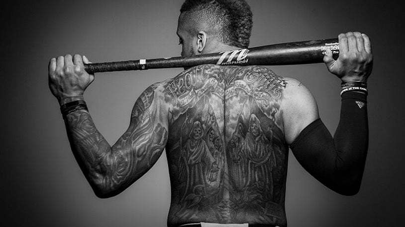 Texas Rangers outfielder Delino DeShields poses for a photo displaying his back tattoo after a spring training workout at the team's training facility on February 19, 2018, in Surprise, Ariz. (Smiley N. Pool/Dallas Morning News/TNS)