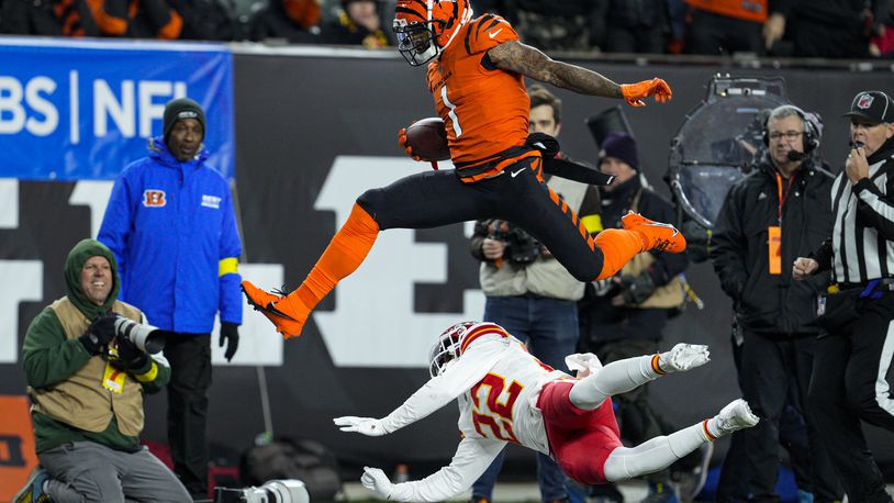 Cincinnati Bengals wide receiver Ja'Marr Chase (1) leaps over Kansas City Chiefs safety Juan Thornhill (22) in the first half of an NFL football game in Cincinnati, Sunday, Dec. 4, 2022. (AP Photo/Jeff Dean)