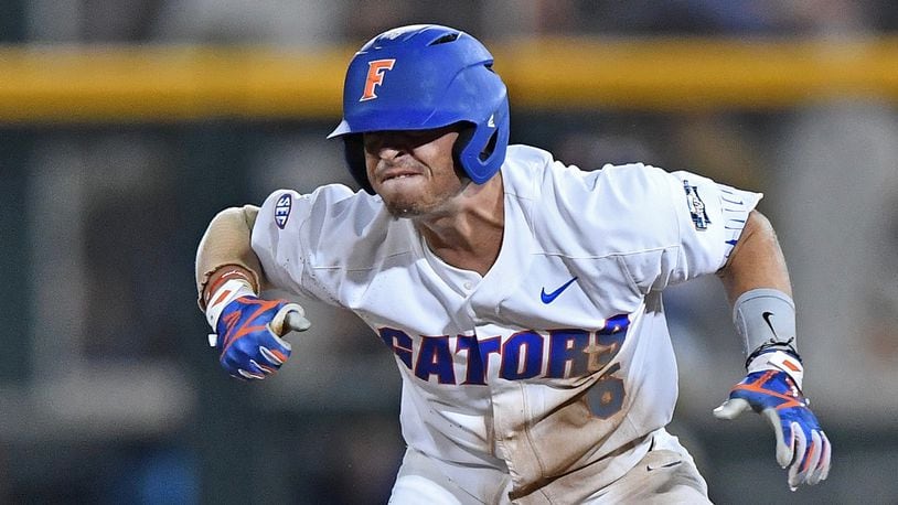 Florida third basemen Jonathan India reacts after hitting a double against LSU