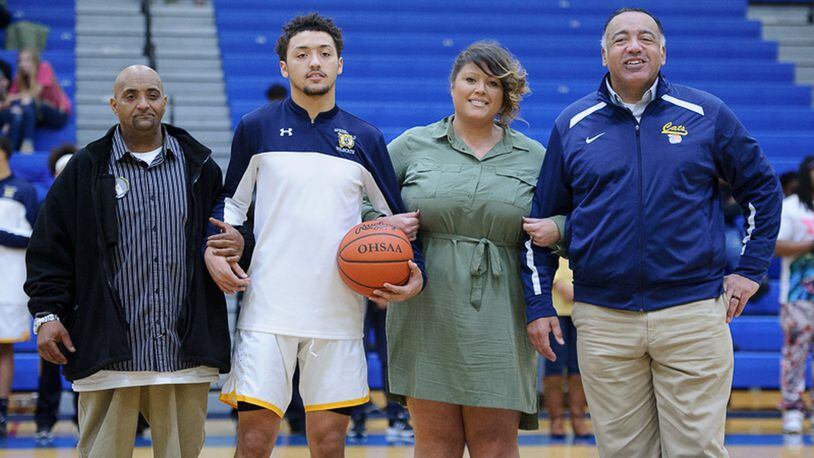 Danny Davis was honored with his family by his side during Springfield’s senior night on Saturday before a game against Miamisburg. From left to right, father Danny Davis II, Danny Davis, mother Michelle Brumfield and step-father Paul Brumfield. BRYANT BILLING / CONTRIBUTED