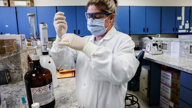 Jennifer Watson, Chemistry Tec. Leader at the Montgomery County Coroner office, extracts possible fentanyl at the lab on West Third St. in Dayton Tuesday April 12, 2022. FILE PHOTO/ STAFF