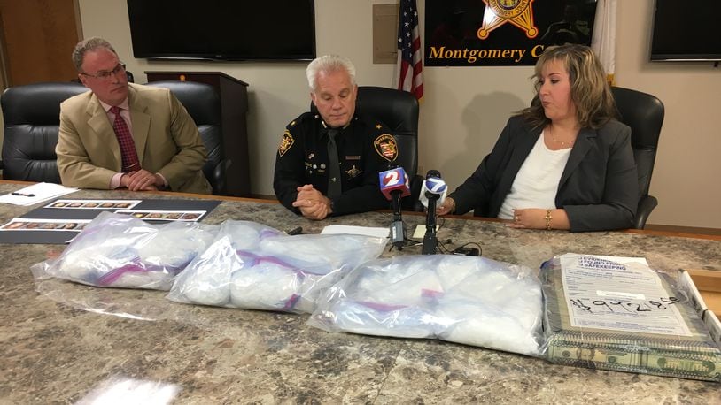 Montgomery County officials held a press conference Thursday to announce a large methamphetamine bust. Seated (from left) are Coroner Kent Harshbarger, Sheriff Phil Plummer and Jail Treatment Coordinator Teresa Russell. STEVE MAGUIRE/STAFF