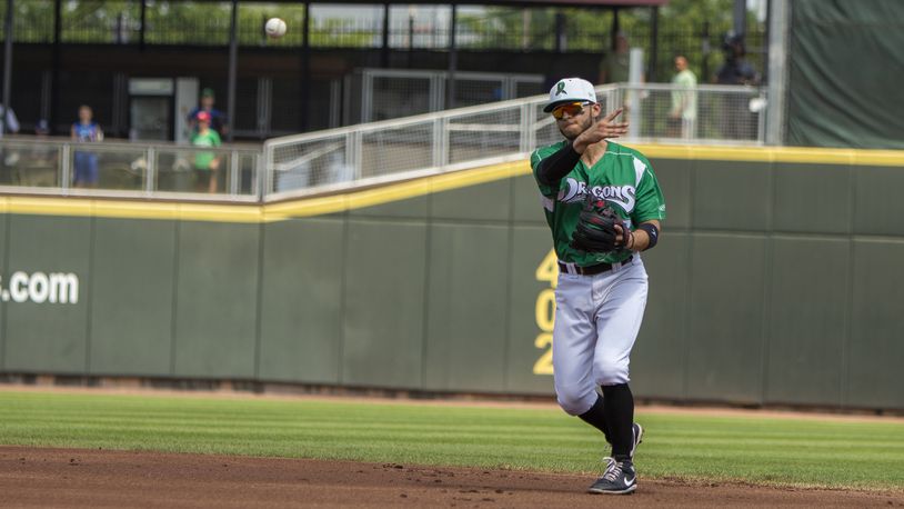 Dragons second baseman Victor Ruiz throws to first for an out during Sunday's game against Lake County at Day Air Ballpark. Jeff Gilbert/CONTRIBUTED