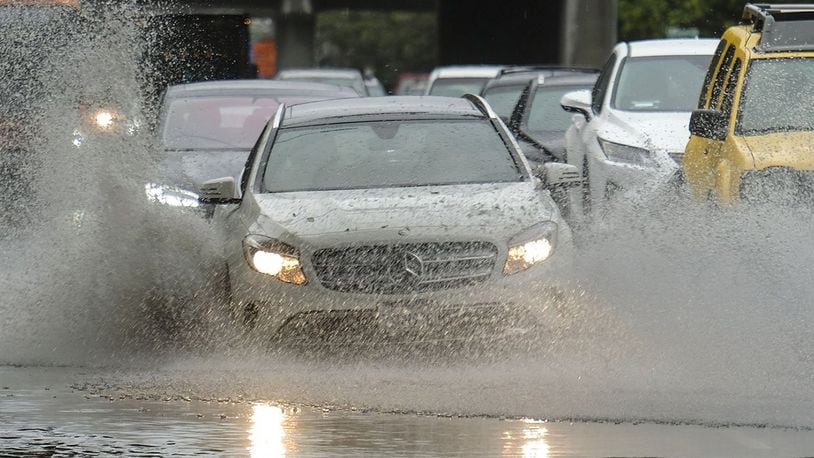 Cars drive on a flooding road during a rain storm on Nov. 29, 2018 in Los Angeles. (Ringo Chiu/Zuma Press/TNS)