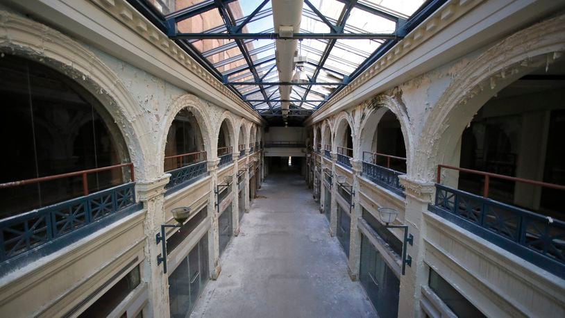 A two-story interior section of the Third Street Dayton Arcade. The city of Dayton Friday pulled a request for $1 million in Montgomery County ED/GE funding to redevelop the arcade — but another funding request is expected in the spring. TY GREENLEES / STAFF