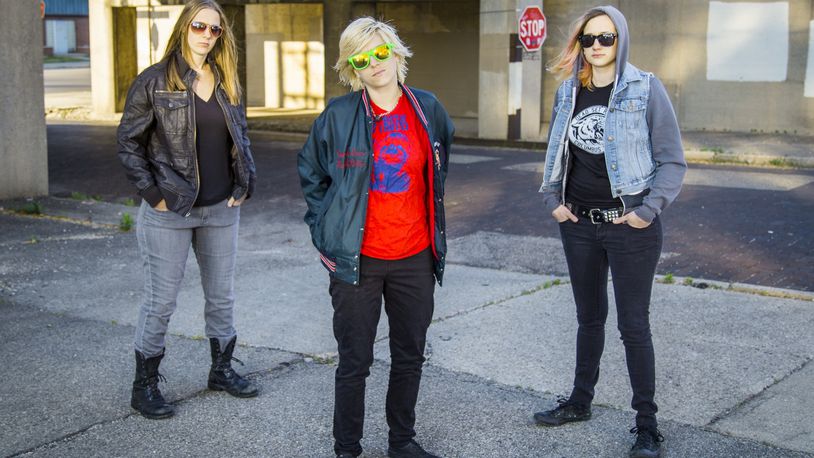 The members of punk trio Jasper The Colossal, (left to right) Sarah Kouse, Paige Beller and Moriah Yux, organized an all-ages benefit for Have A Gay Day at Yellow Cab Tavern in Dayton on Saturday, Sept. 24.