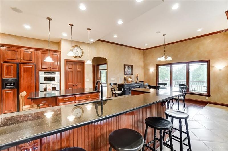 Situated on a 4.3-acre lot to allow panoramic views of the rolling lawn and nearby reserve, this 5,410 square-foot brick ranch built in 2004 on Tipp Canal Road was listed for $995,000. PHOTOS COURTESY OF DAYTON REALTORS.