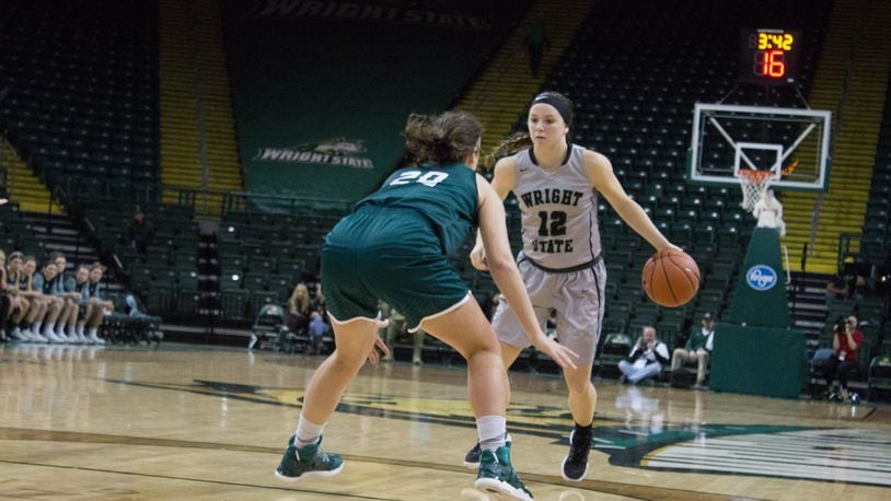 Wright State’s Mackenzie Taylor looks to drive past Green Bay’s Caitlyn Hibner during Thursday’s game at the Nutter Center. Allison Rodriguez/CONTRIBUTED