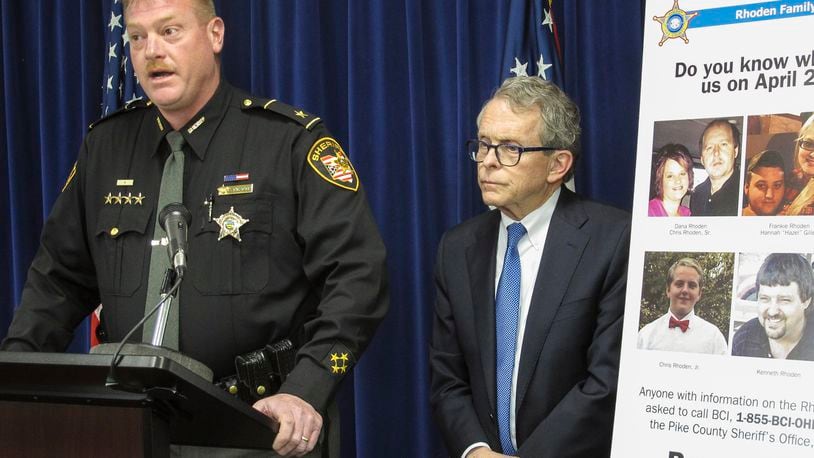 Pike County Sheriff Charles Reader, left, discusses the ongoing investigation into the unsolved killings of eight family members in southern Ohio on April 22, 2016, at a news conference attended by Attorney General Mike DeWine, whose office is leading the investigation, on Thursday, April 13, 2017, in Columbus, Ohio. Reader and DeWine both said they believe individuals may be holding back information out of fear of self-incrimination over their own, unrelated drug crimes. (AP Photo/Andrew Welsh-Huggins)