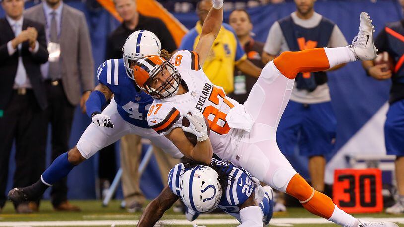 INDIANAPOLIS, IN - SEPTEMBER 24: Seth DeValve #87 of the Cleveland Browns is tackled by Malik Hooker #29 and Matthias Farley #41 of the Indianapolis Colts during the first half at Lucas Oil Stadium on September 24, 2017 in Indianapolis, Indiana. (Photo by Michael Reaves/Getty Images)