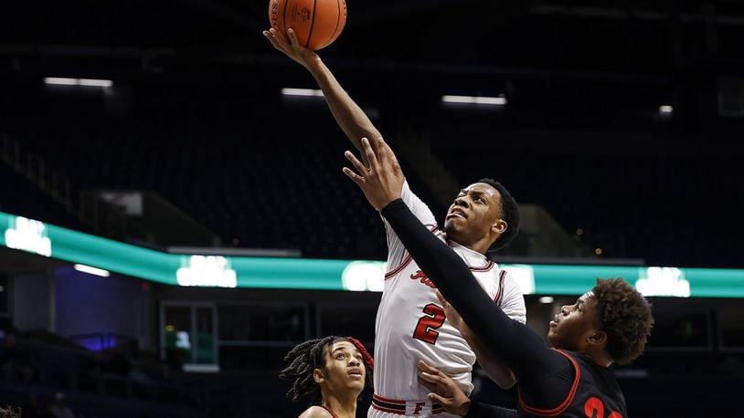 Fairfield's Deshawne Crim goes to the hoop defended by Wayne's Juan Cranford Jr. during their Division I regional basketball game Wednesday, March 9, 2022 at Cintas Center on the Xavier University campus in Cincinnati. Fairfield won 51-42. NICK GRAHAM/STAFF