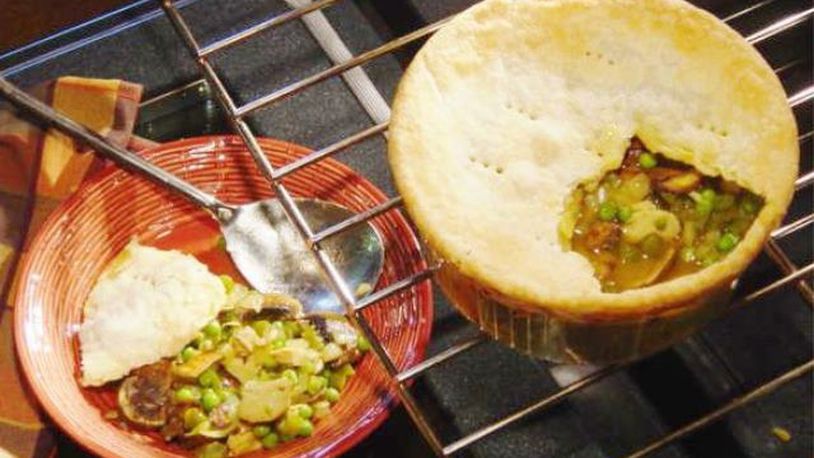 Curry powder added to the sauce gives this chicken pot pie an intriguing flavor. (Linda Gassenheimer/TNS)
