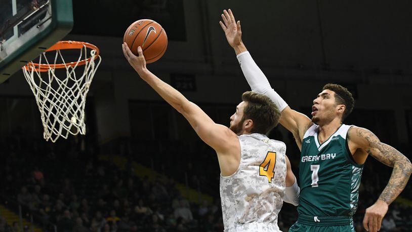 Wright State’s Alan Vest puts up a shot as Green Bay’s Sandy Cohen defends during a game earlier this season at the Nutter Center. Keith Cole/CONTRIBUTED