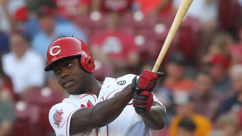 Reds outfielder Aristides Aquino warms up before an at-bat against the Cardinals on Thursday, Aug. 15, 2019, at Great American Ball Park in Cincinnati. David Jablonski/Staff