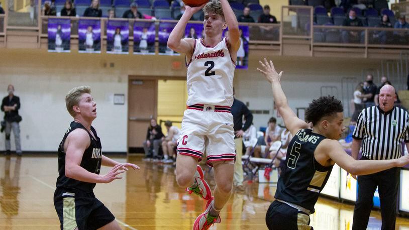 Cedarville senior Trent Koning shoots over Botkins' Jayden Priddy-Powell (5) and Zane Paul during Friday night's Division IV region final at Butler High School. Koning scored 14 points, but the Indians lost 42-40. Jeff Gilbert/CONTRIBUTED