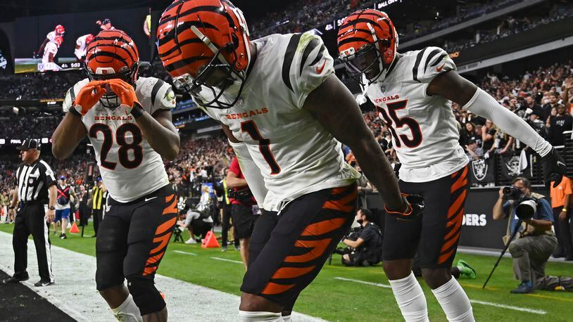 Cincinnati Bengals wide receiver Ja'Marr Chase (1) celebrates after scoring a touchdown against the Las Vegas Raiders during the second half of an NFL football game, Sunday, Nov. 21, 2021, in Las Vegas. (AP Photo/David Becker)