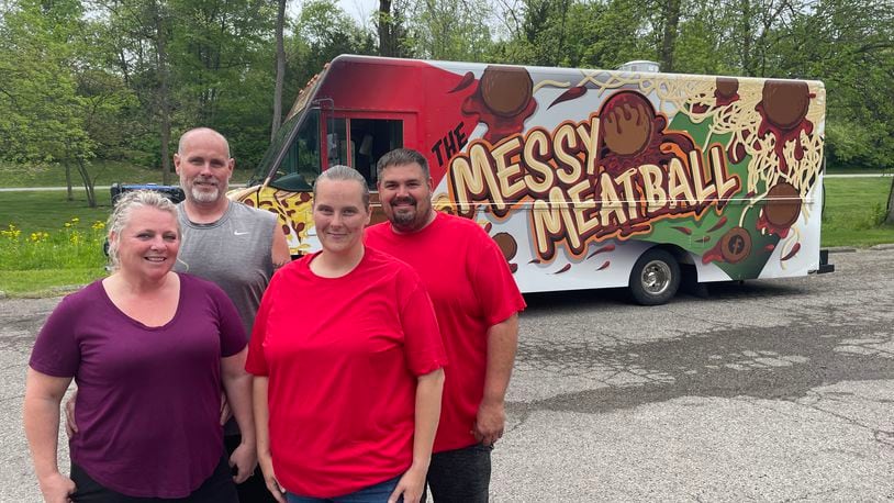 Pictured left to right are Crystal Moberly, Donnie Moberly, Angela Ashburn and  Jeremy Vanmeter, who operate The Messy Meatball and DC's Burgers & More food trucks. NATALIE JONES/STAFF