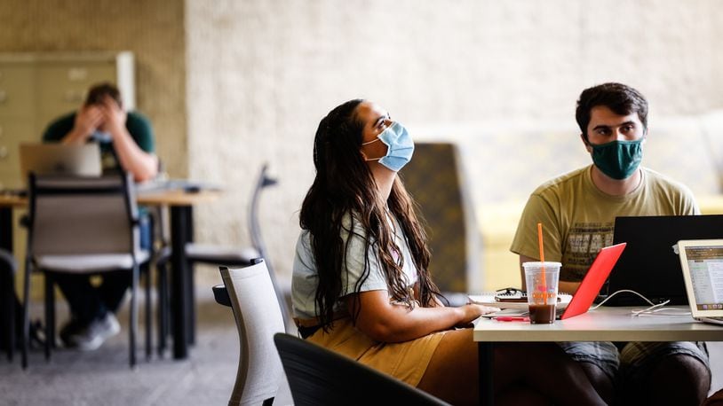 From left, Wright State University students, Anna Vandewiele from Beavercreek and Jonathan Ciero from Ranstein, Germany study at the library on campus Wednesday August 25, 2021. Weight State has issued a mask mandate in all of it buildings. JIM NOELKER/STAFF