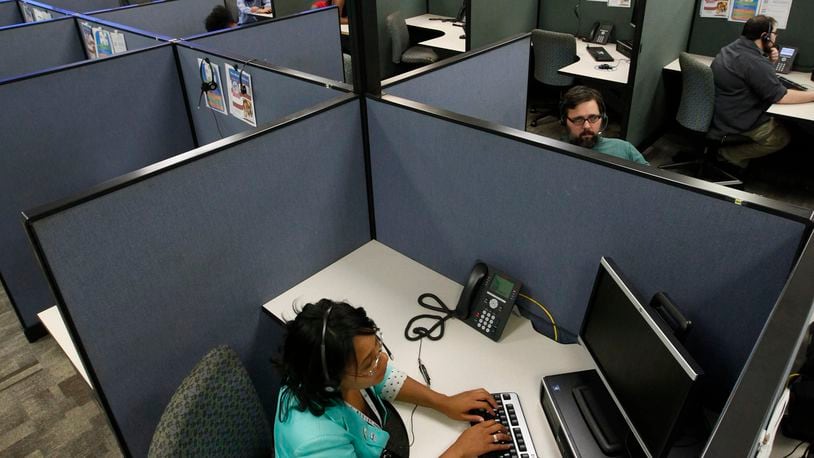 Teleperformance employees in the company’s Fairborn offices, in this 2014 file photo. TY GREENLEES / STAFF