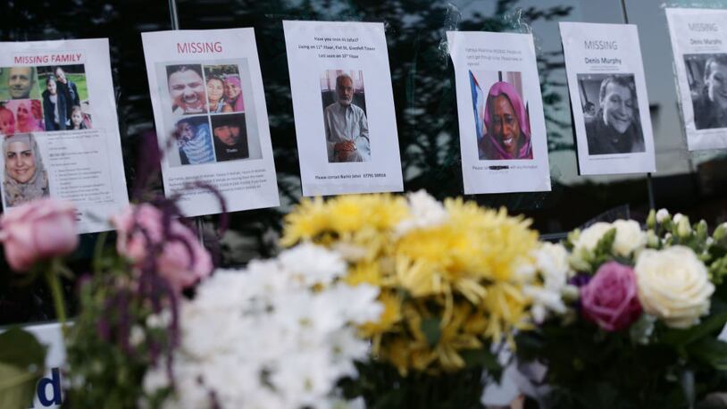 Posters close to Grenfell Tower in west London depict missing persons after a fire engulfed the 24-story building on Wednesday morning.