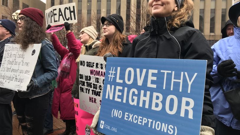 Despite the rainy weekend weather, people gathered at Courthouse Square in Downtown Dayton Saturday, January 18, for the 2020 Dayton Women’s March. Staff photo / Sarah Franks