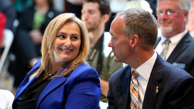 Kristi Tanner, an executive overseeing automotive investments for Jobs Ohio, with Jeff Hoagland, president and chief executive of the Dayton Development Coalition, at a 2015 event at Carillon Historical Park. LISA POWELL/STAFF
