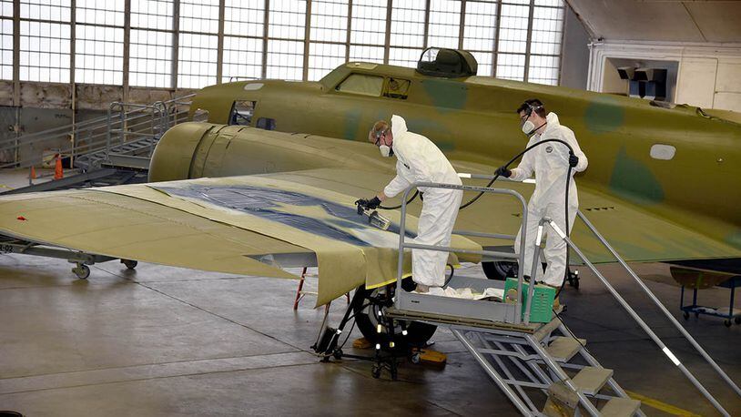Museum of the U.S. Air Force restoration crews continue the painting process on the Boeing B-17F Memphis Belle. Plans call for the aircraft to be placed on permanent public display in the WWII Gallery at the National Museum of the U.S. Air Force on May 17. (U.S. Air Force photos/Ken LaRock)