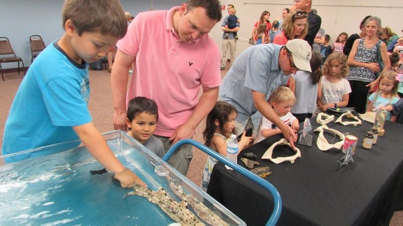 Families learned about sharks and enjoyed a chance to pet them at an educational program during Wright Memorial Library’s 2016 Summer Reading Club. The library plans to use a new grant to expand its educational programming and services. CONTRIBUTED