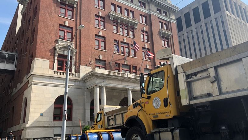 Street maintenance trucks parked outside of Dayton City Hall in 2019. CORNELIUS FROLIK / STAFF