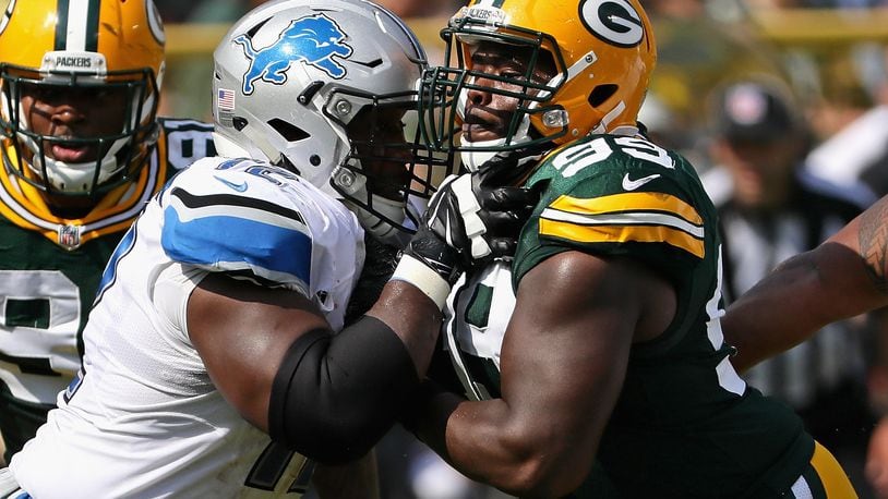 GREEN BAY, WI - SEPTEMBER 25: Christian Ringo #99 of the Green Bay Packers rushes against Laken Tomlinson #72 of the Detroit Lions at Lambeau Field on September 25, 2016 in Green Bay, Wisconsin. (Photo by Jonathan Daniel/Getty Images)