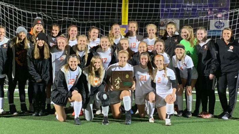 The Waynesville girls soccer team pictured after winning the Division III regional championship on Saturday. The Spartans will play in the state semifinals on Tuesday night. CONTRIBUTED