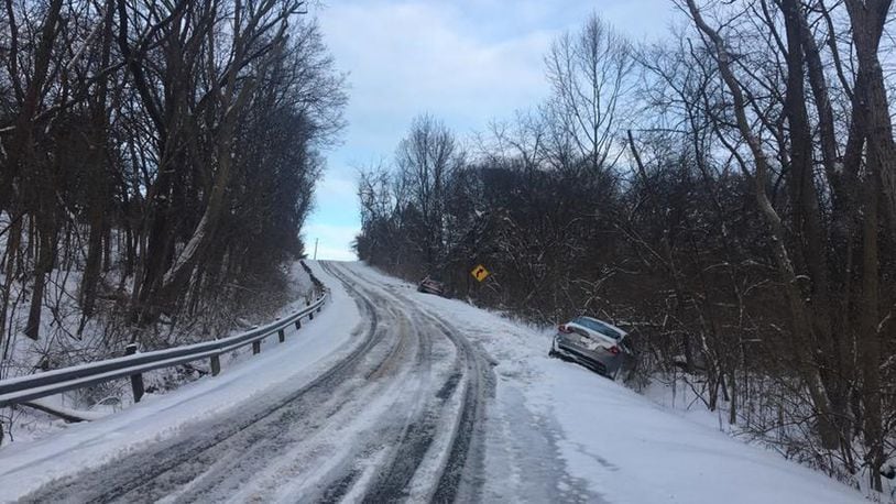 Deputies blocked a portion of Brush Row Road between Stevenson and Mason roads in Greene County due to several slide-offs Sunday. (Noah Fickert/Staff)