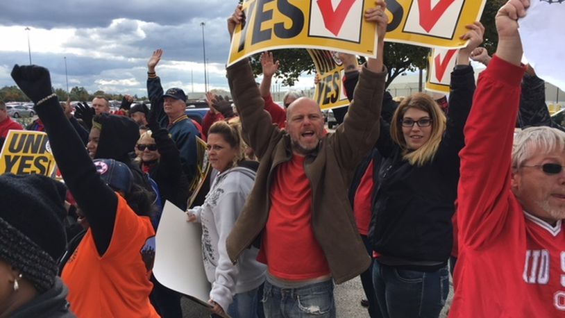 United Auto Workers and supporters rallied outside Fuyao Glass America in Moraine Oct. 25. THOMAS GNAU/STAFF