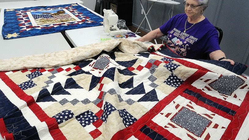 Sarah Shell works on one of her quilts Thursday, Aug. 17, 2023 for Quilts of Valor at the Englewood Earl Heck Community Center. Shell is part of a group of volunteers who sew quilts for veterans. MARSHALL GORBY\STAFF