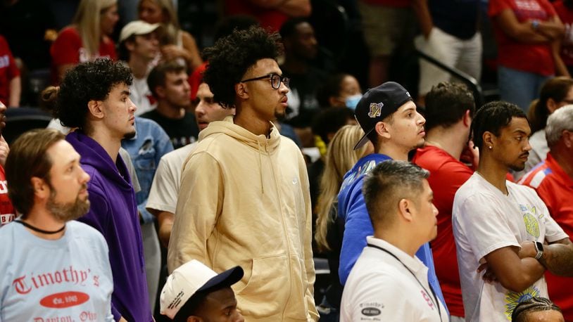 Jazz Gardner, center, a 2023 recruit, watches the Red Scare play The Money Team on Wednesday, July 27, in the third round of The Basketball Tournament at UD Arena in Dayton. David Jablonski/Staff