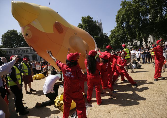 Photos: Baby Trump balloon flies over London protests