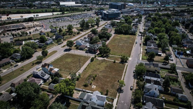 Dayton Children's wants to build new kinship housing on this vacant land in Old North Dayton. Dayton Children's can be seen in the background; Alaska Street is on right and Rita Street is on the left. JIM NOELKER/STAFF