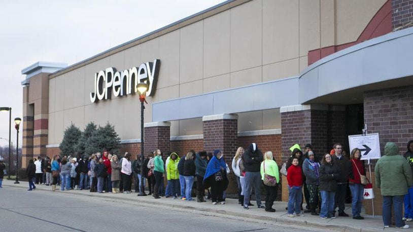 Holiday shoppers wait in line on Thanksgiving Day for early deals at JCPenney at the Bridgewater Falls shopping center, Thursday, Nov. 27, 2014. GREG LYNCH / STAFF