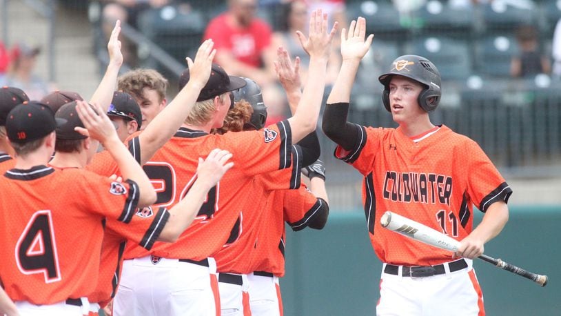 Coldwater’s Sam Broering returns to the dugout after scoring against Minford in a Division III state semifinal on Thursday, May 31, 2018, at Huntington Park in Columbus. David Jablonski/Staff