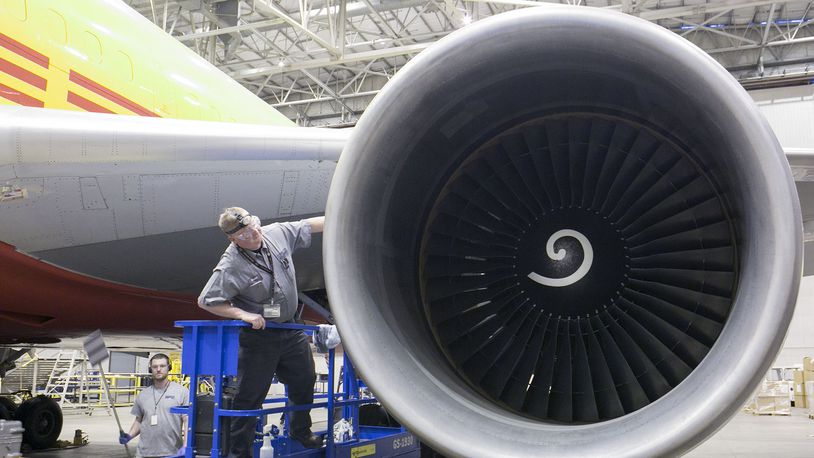 Aircraft and Powerplant mechanic Scott Yancey inspects the intake area of a GE CF-6 engine mounted on a Boeing 767-200 for Airborne Maintenance and Engineering Services at the Wilmington Air Park in this 2015 file photo.
