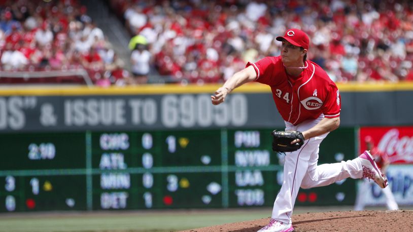 Reds starter Homer Bailey pitches against the Rockies on Sunday, May 11, 2014, at Great American Ball Park in Cincinnati. David Jablonski/Staff