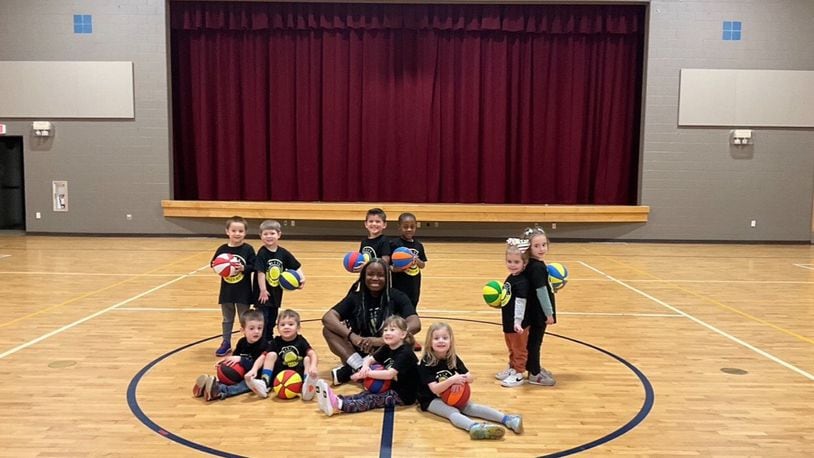 Bri Kreider – “Coach Bri” to her Bitty Ballers – pictured with her young basketball players on Wednesday. CONTRIBUTED