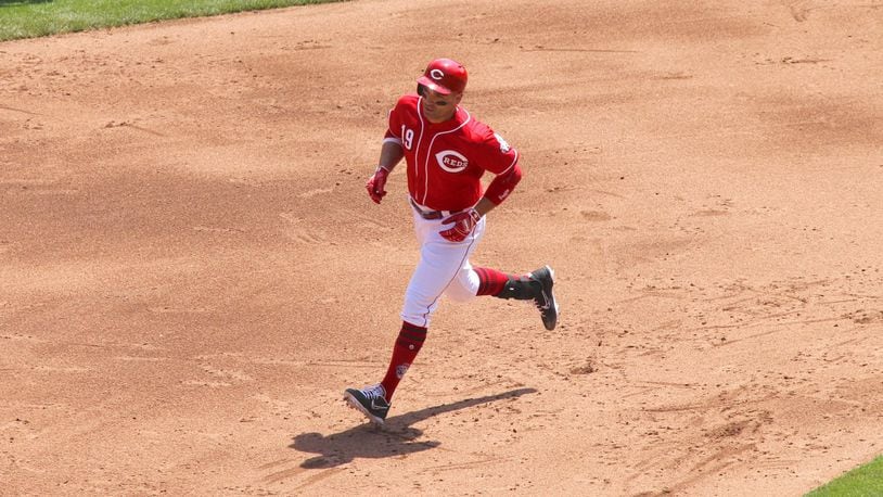 The Reds’ Joey Votto rounds the bases after a three-run home run against the Braves on Thursday, April 26, 2018, at Great American Ball Park in Cincinnati. David Jablonski/Staff